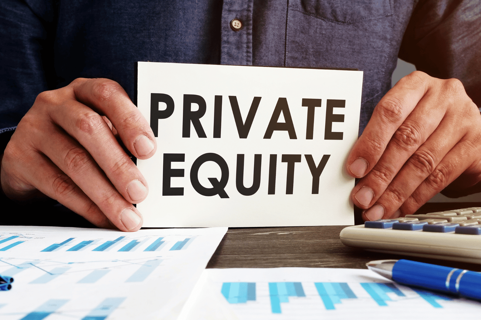 Image of a man holding a card with the words 'Private Equity' written on it